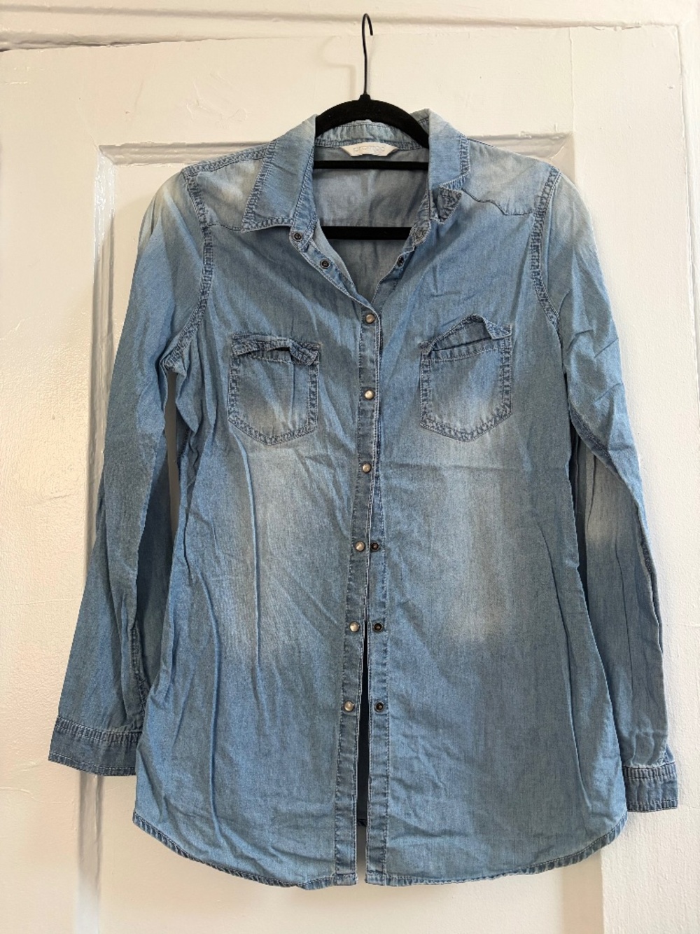 Light denim shirt with white buttons